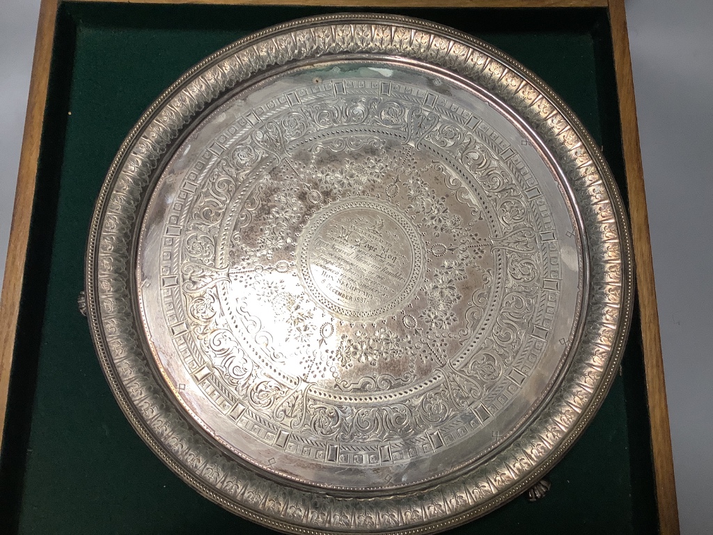 A Victorian engraved silver presentation salver by John Edward Bingham, Sheffield, 1885, width 35.6 cm, 32 oz, in oak box.